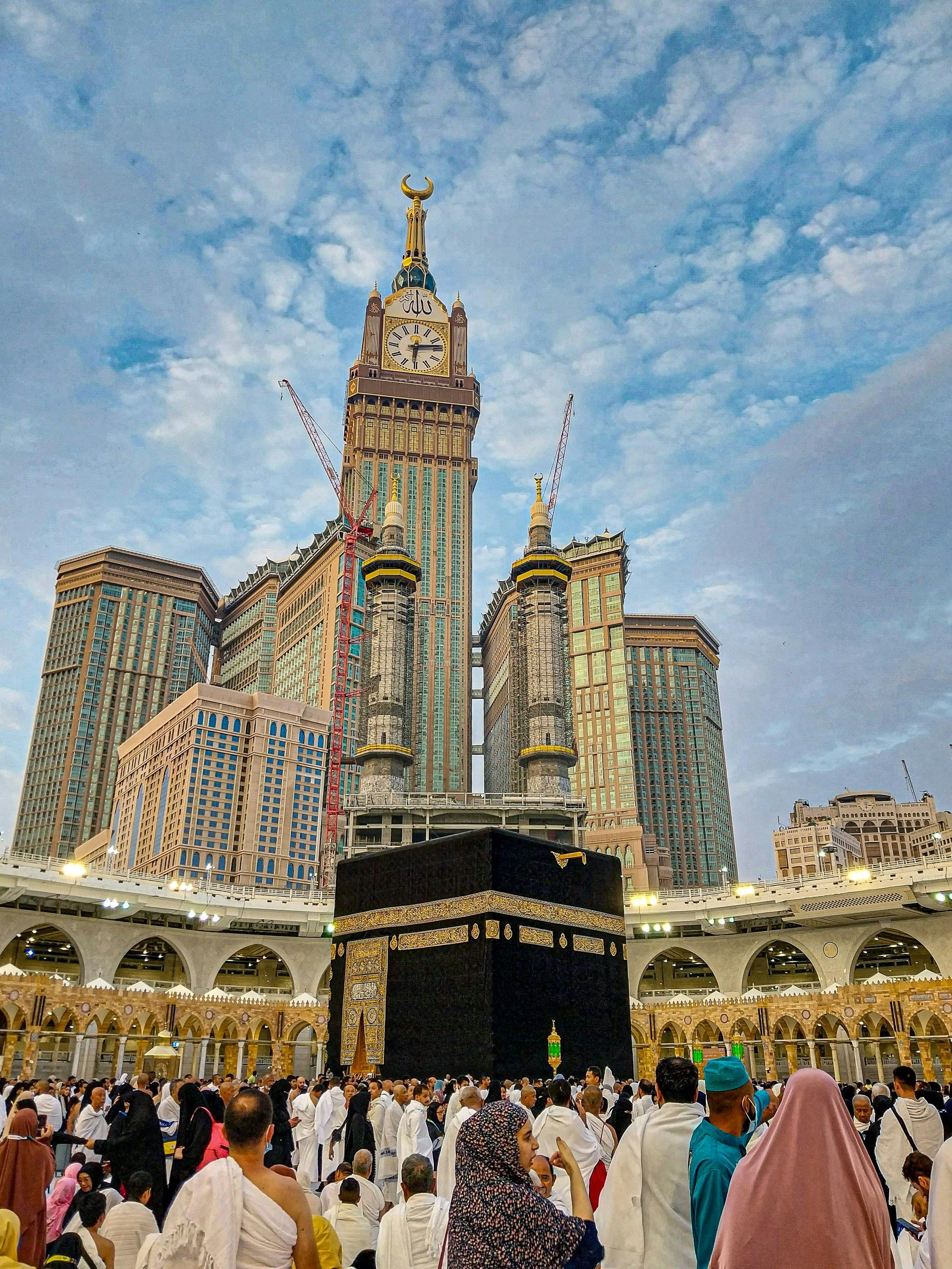 The Kaaba with the Abraj Al Bait hotel towers rising directly behind it